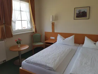 Ein Bett oder Betten in einem Zimmer der Unterkunft Eisenbahnwelten