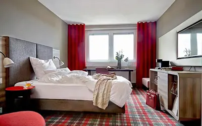 Ein Bett oder Betten in einem Zimmer der Unterkunft Seaside Residenz Hotel Chemnitz