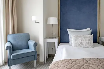 Ein Bett oder Betten in einem Zimmer der Unterkunft Dorint Parkhotel Meißen