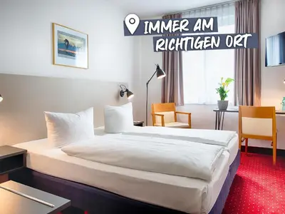 Ein Bett oder Betten in einem Zimmer der Unterkunft ACHAT Hotel Chemnitz
