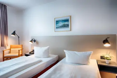 Ein Bett oder Betten in einem Zimmer der Unterkunft ACHAT Hotel Chemnitz