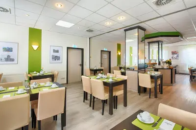 Ein Restaurant oder anderes Speiselokal in der Unterkunft ACHAT Hotel Chemnitz