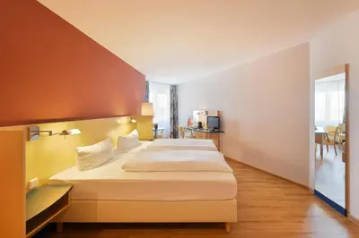 Ein Bett oder Betten in einem Zimmer der Unterkunft Amedia Dresden Elbpromenade, Trademark Collection by Wyndham
