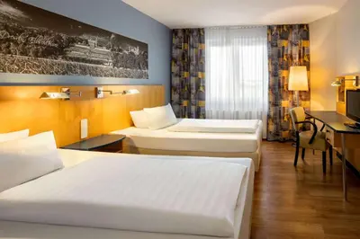 Ein Bett oder Betten in einem Zimmer der Unterkunft Amedia Dresden Elbpromenade, Trademark Collection by Wyndham