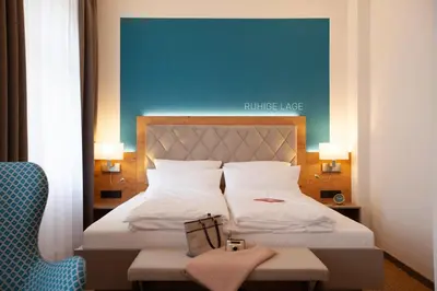 Ein Bett oder Betten in einem Zimmer der Unterkunft Hotel Ross