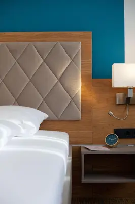 Ein Bett oder Betten in einem Zimmer der Unterkunft Hotel Ross