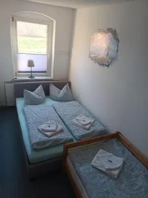 Ein Bett oder Betten in einem Zimmer der Unterkunft Ferienwohnung Beim Rößl