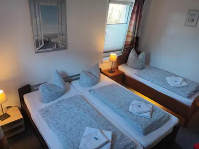 Ein Bett oder Betten in einem Zimmer der Unterkunft Ferienwohnung Beim Rößl