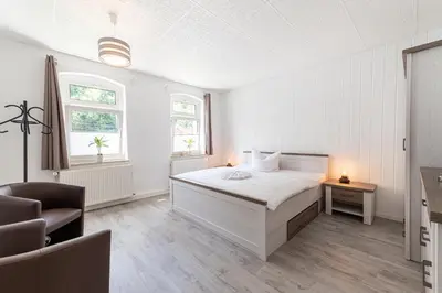 Ein Bett oder Betten in einem Zimmer der Unterkunft Haus am Malerweg
