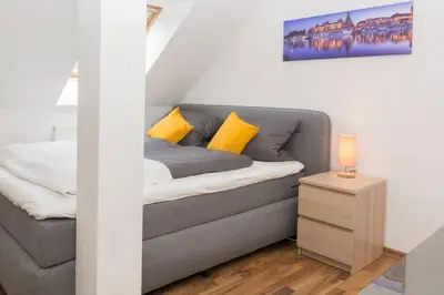 Ein Bett oder Betten in einem Zimmer der Unterkunft Rooftop - das Apartment mit Dachterrasse