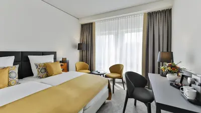 Ein Bett oder Betten in einem Zimmer der Unterkunft Dorint Hotel Dresden