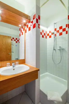 Ein Badezimmer in der Unterkunft Kim Hotel Im Park