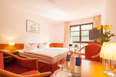 Ein Bett oder Betten in einem Zimmer der Unterkunft Kim Hotel Im Park