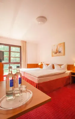 Ein Bett oder Betten in einem Zimmer der Unterkunft Kim Hotel Im Park