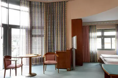 Ein Bett oder Betten in einem Zimmer der Unterkunft Hotel Am Blauen Wunder