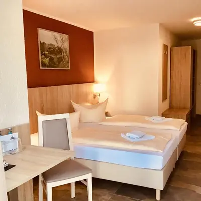 Ein Bett oder Betten in einem Zimmer der Unterkunft Hotel Reichskrone