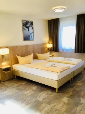 Ein Bett oder Betten in einem Zimmer der Unterkunft Hotel Reichskrone