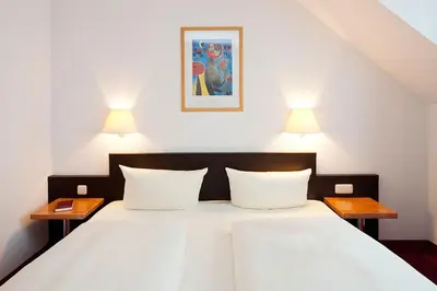 Ein Bett oder Betten in einem Zimmer der Unterkunft Hotel Garden Cottage mit kostenfreien Parkplätzen