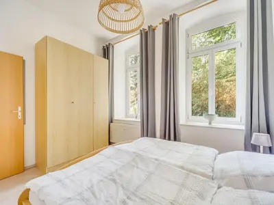 Ein Bett oder Betten in einem Zimmer der Unterkunft Wohnung mit großer Gemeinschaftsterrasse