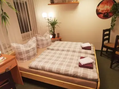 Ein Bett oder Betten in einem Zimmer der Unterkunft Gästezimmer- und Ferienzimmer Am Gewölbekeller Meißen