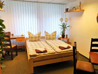 Ein Bett oder Betten in einem Zimmer der Unterkunft Gästezimmer- und Ferienzimmer Am Gewölbekeller Meißen