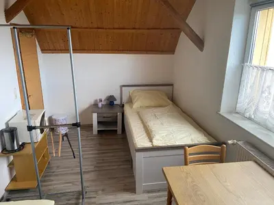 Ein Sitzbereich in der Unterkunft Zimmervermietung Graupner