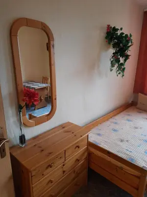 Ein Bett oder Betten in einem Zimmer der Unterkunft Spiegelland - Zuhause für Mitarbeiter