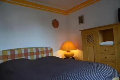 Ein Bett oder Betten in einem Zimmer der Unterkunft Kleiner Burgblick