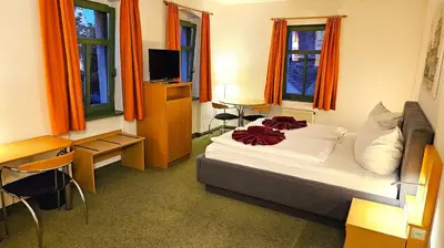 Ein Bett oder Betten in einem Zimmer der Unterkunft Gutshof Hauber