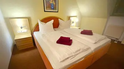 Ein Bett oder Betten in einem Zimmer der Unterkunft Gutshof Hauber