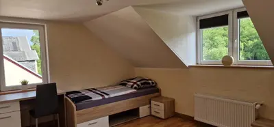 Ein Bett oder Betten in einem Zimmer der Unterkunft Ferienwohnung Erzhütte