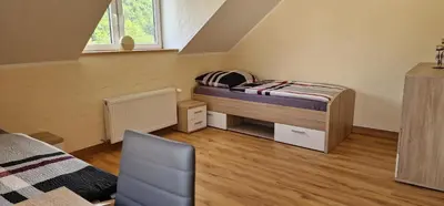 Ein Bett oder Betten in einem Zimmer der Unterkunft Ferienwohnung Erzhütte