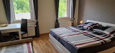 Ein Bett oder Betten in einem Zimmer der Unterkunft Ferienwohnung Erzhütte