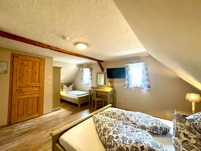 Ein Bett oder Betten in einem Zimmer der Unterkunft Land & Leben Pension