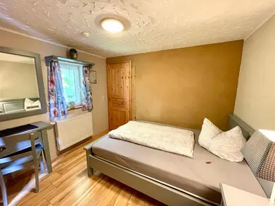Ein Bett oder Betten in einem Zimmer der Unterkunft Land & Leben Pension