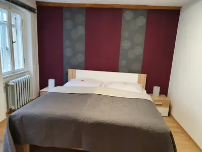 Ein Bett oder Betten in einem Zimmer der Unterkunft Ferienwohnung Ines Wolf in der Meißner Innenstadt