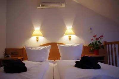 Ein Bett oder Betten in einem Zimmer der Unterkunft Hotel Alttolkewitzer Hof