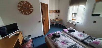 Ein Bett oder Betten in einem Zimmer der Unterkunft Alte Post zu Stetzsch