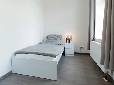 Ein Bett oder Betten in einem Zimmer der Unterkunft Moderne City Appartments im Stadtzentrum