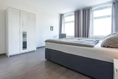 Ein Bett oder Betten in einem Zimmer der Unterkunft Moderne City Appartments im Stadtzentrum