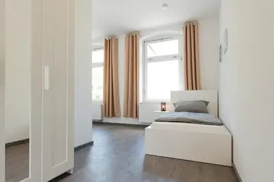 Ein Bett oder Betten in einem Zimmer der Unterkunft Moderne City Appartments im Stadtzentrum