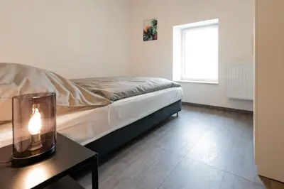Ein Bett oder Betten in einem Zimmer der Unterkunft Moderne City Appartments im Stadtzentrum