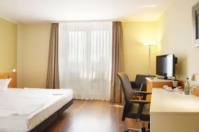 Ein Bett oder Betten in einem Zimmer der Unterkunft Best Western Macrander Hotel Dresden
