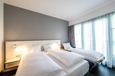 Ein Bett oder Betten in einem Zimmer der Unterkunft Dresdner Tor Süd