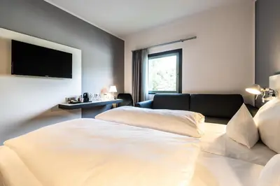 Ein Bett oder Betten in einem Zimmer der Unterkunft Dresdner Tor Süd