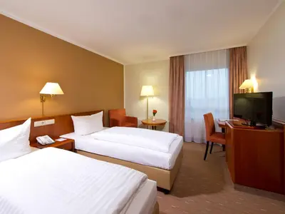 Ein Bett oder Betten in einem Zimmer der Unterkunft ACHAT Hotel Schwarzheide Lausitz