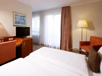 Ein Bett oder Betten in einem Zimmer der Unterkunft ACHAT Hotel Schwarzheide Lausitz