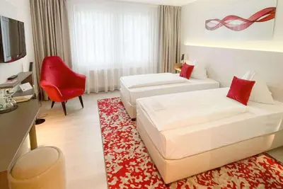Ein Bett oder Betten in einem Zimmer der Unterkunft Ramada by Wyndham Dresden