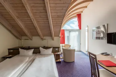 Ein Bett oder Betten in einem Zimmer der Unterkunft Andante Hotel Dresden