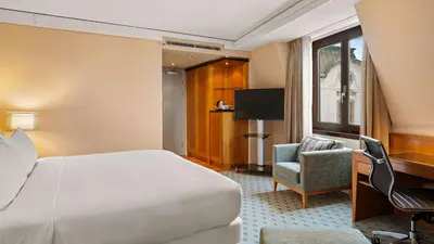 Ein Bett oder Betten in einem Zimmer der Unterkunft Hilton Dresden an der Frauenkirche